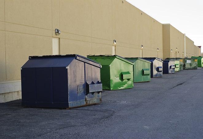 an assortment of sturdy and reliable waste containers near a construction area in Athena OR